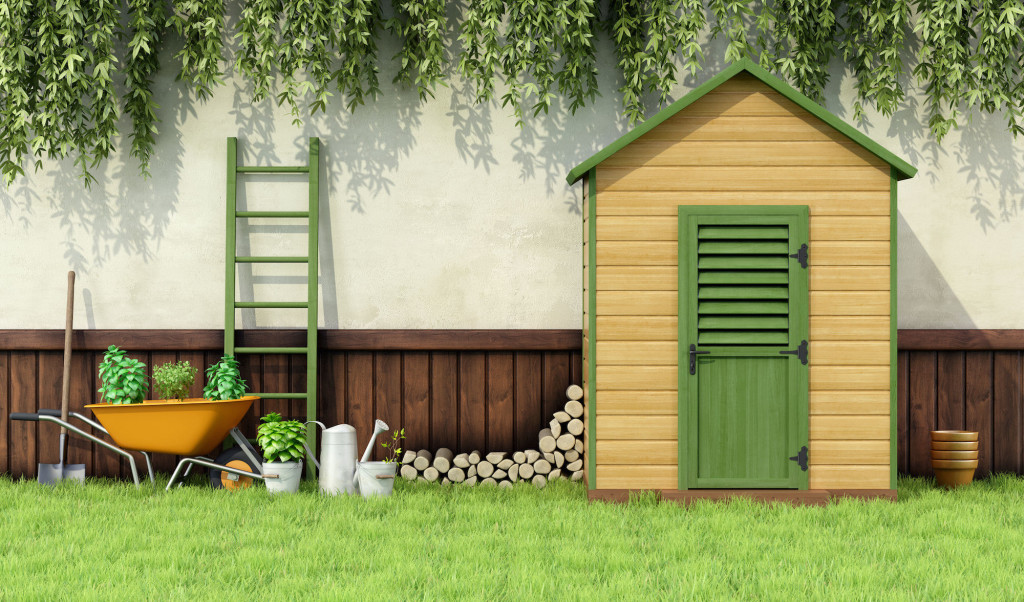 Garden with gardening tools and wooden shed with closed door - 3D Rendering