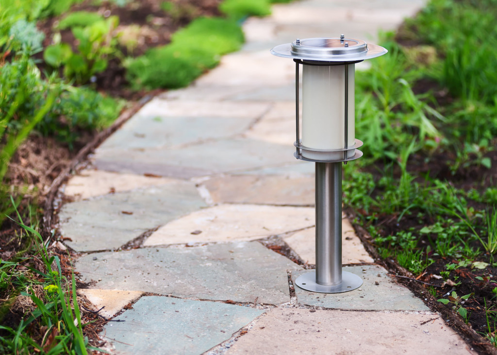 Solar-powered lamp on garden path.